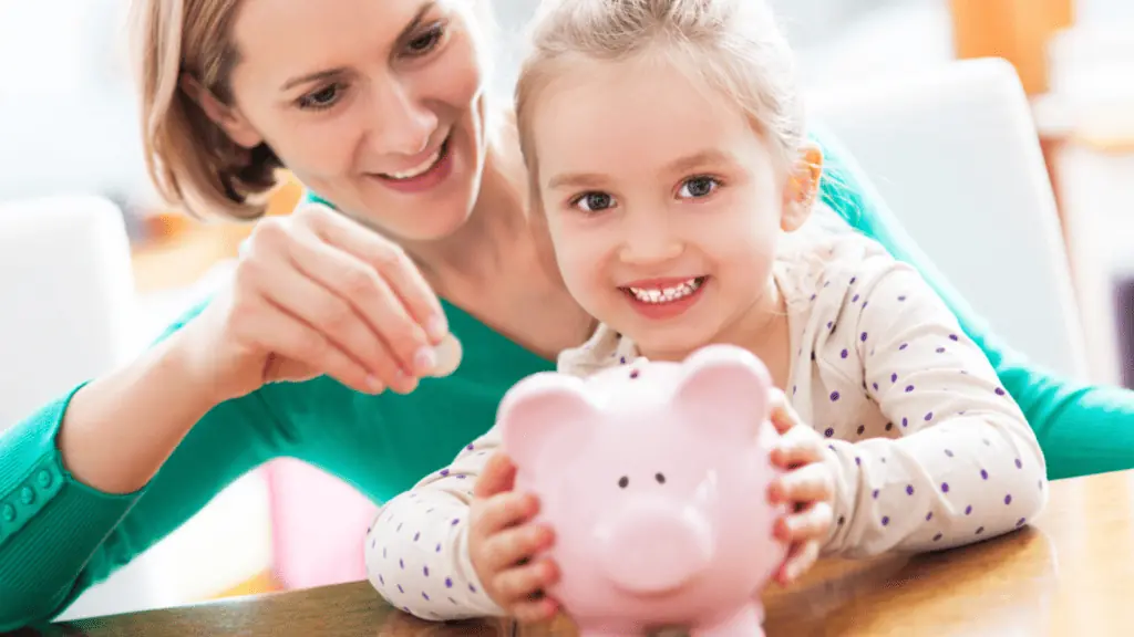 piggy bank mom and daughter saving money