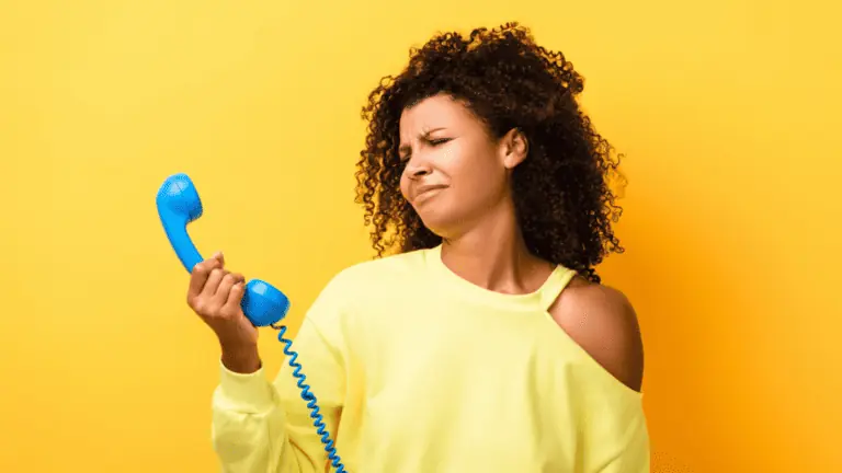 confused woman on a blue phone