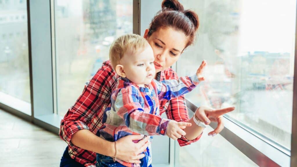mom and son looking out the window