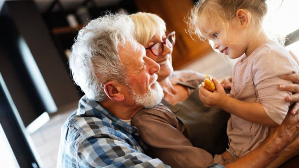 happy grandparents with grandchild