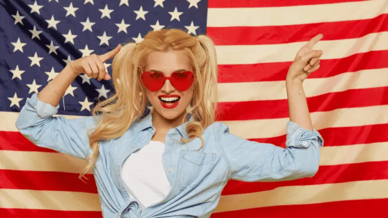 american woman red glasses with a flag pig tails smiling pointing