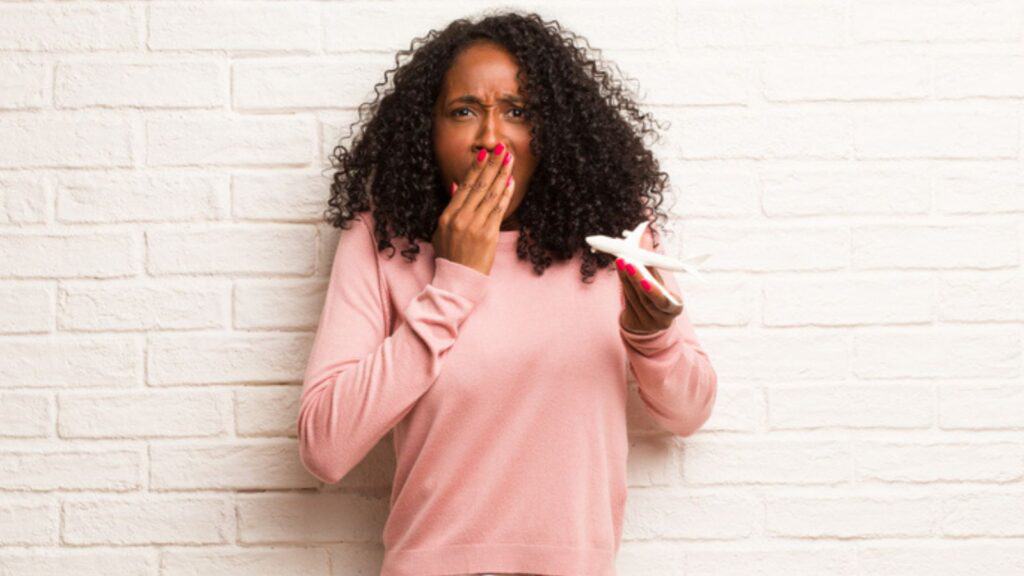 shocked woman holding an airplane