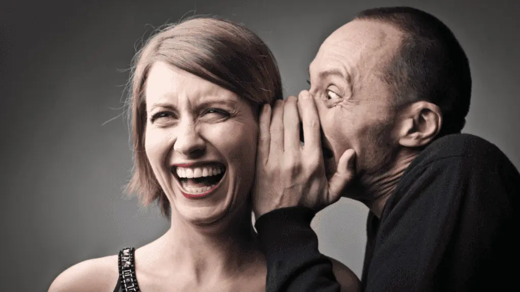 man telling a joke woman smiling laughing funny