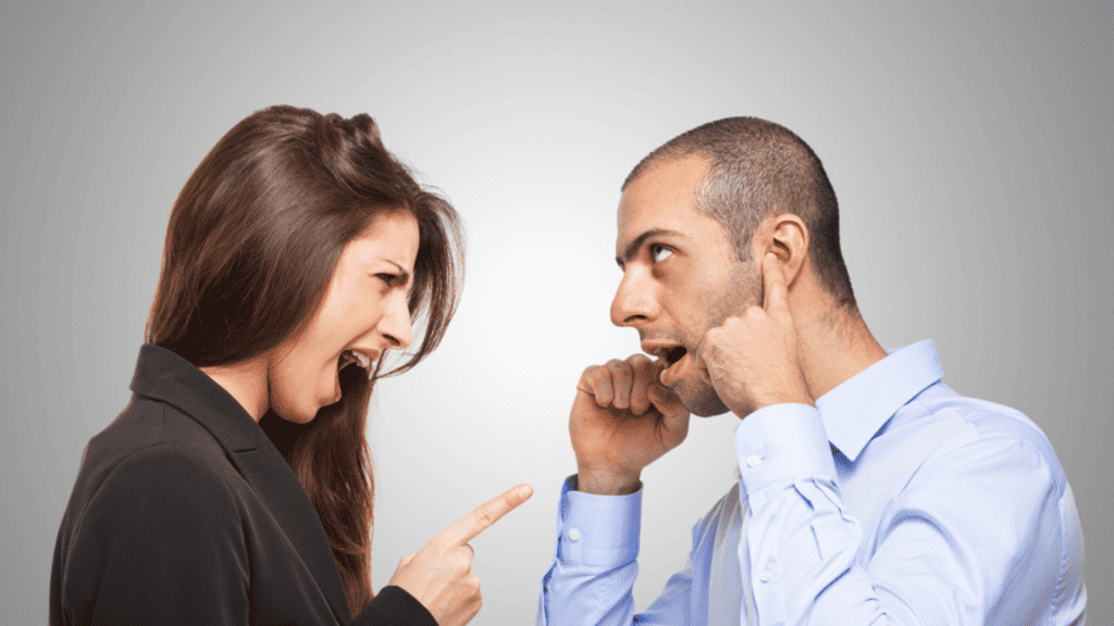 annoyed woman annoying man plugging his ears yelling couple