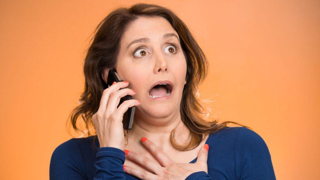 shocked woman on the phone