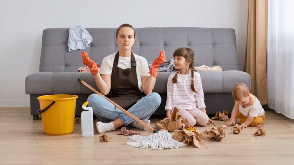 tired mom cleaning a mess with toddler and baby meditation