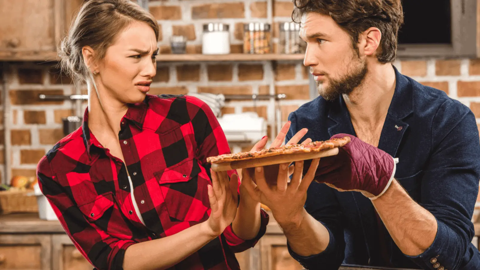 woman disgusted pizza couple cooking kitchen