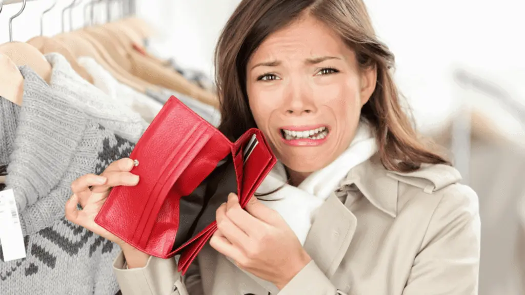 woman without money sad poor wallet shopping