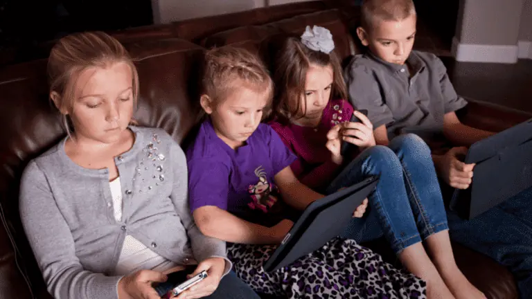 kids on phones and tablets technology couch