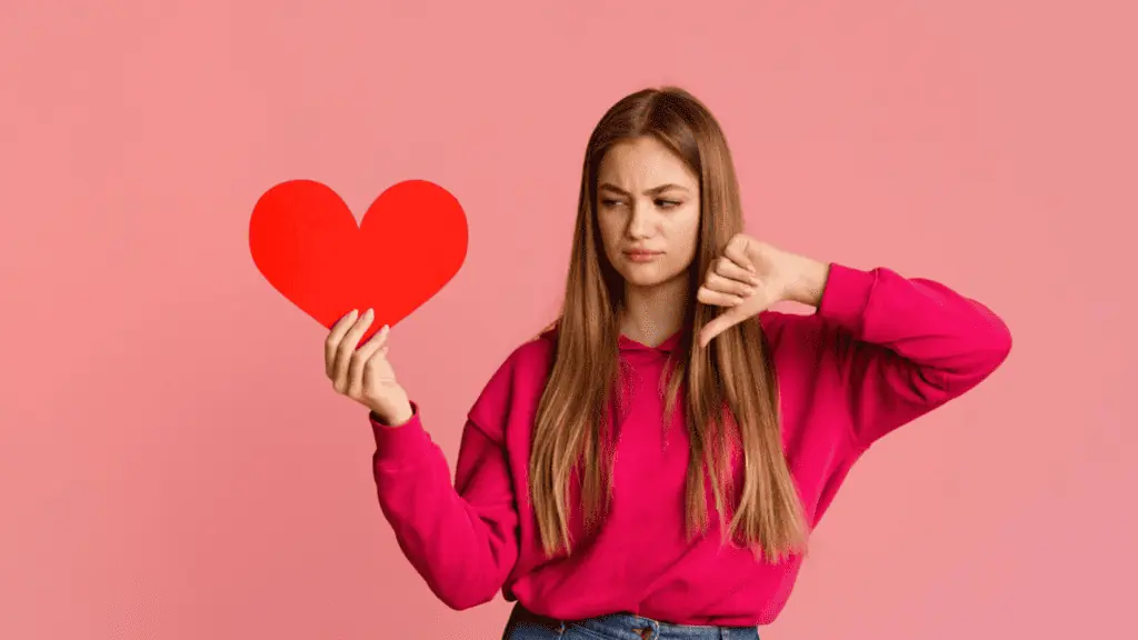 heart sad woman thumbs down breakup