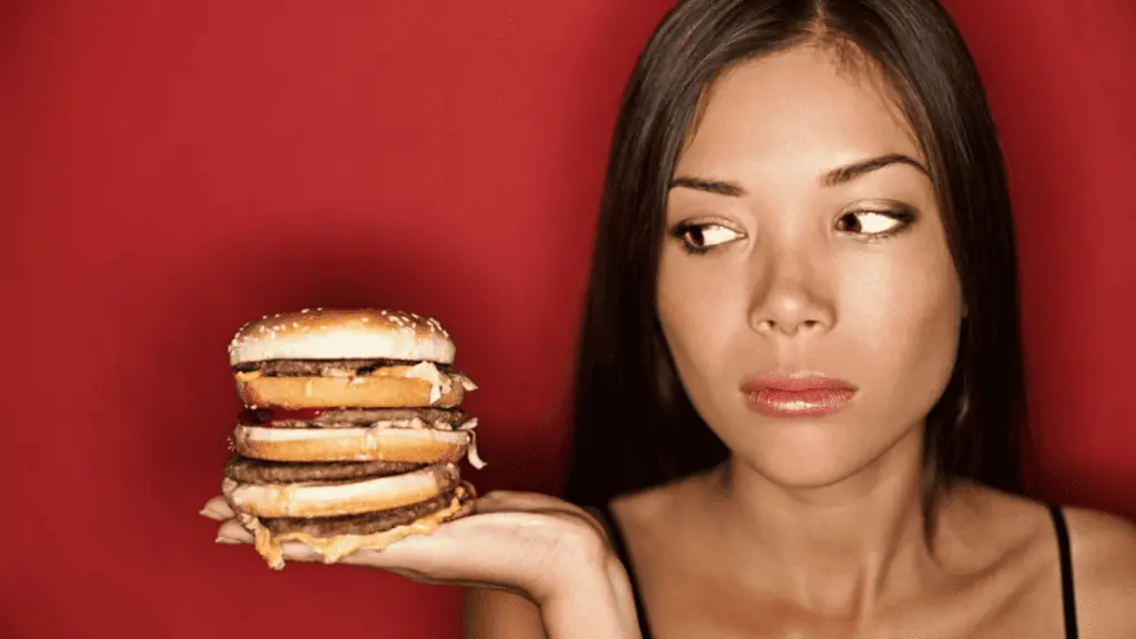 woman with a burger fast food red