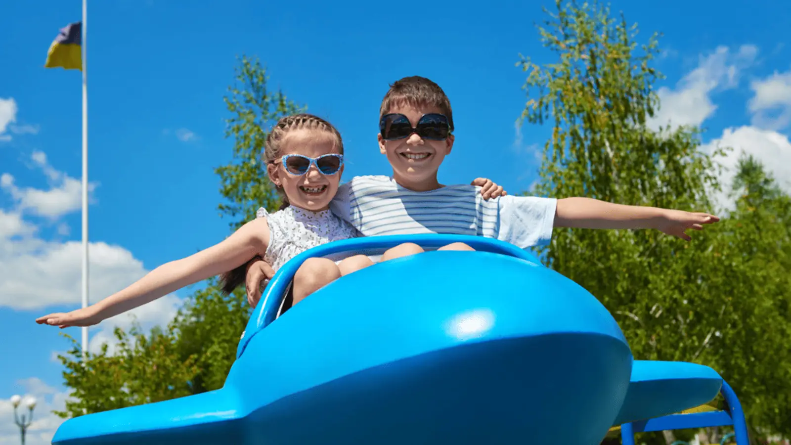 kids on a ride plane summer fair fun