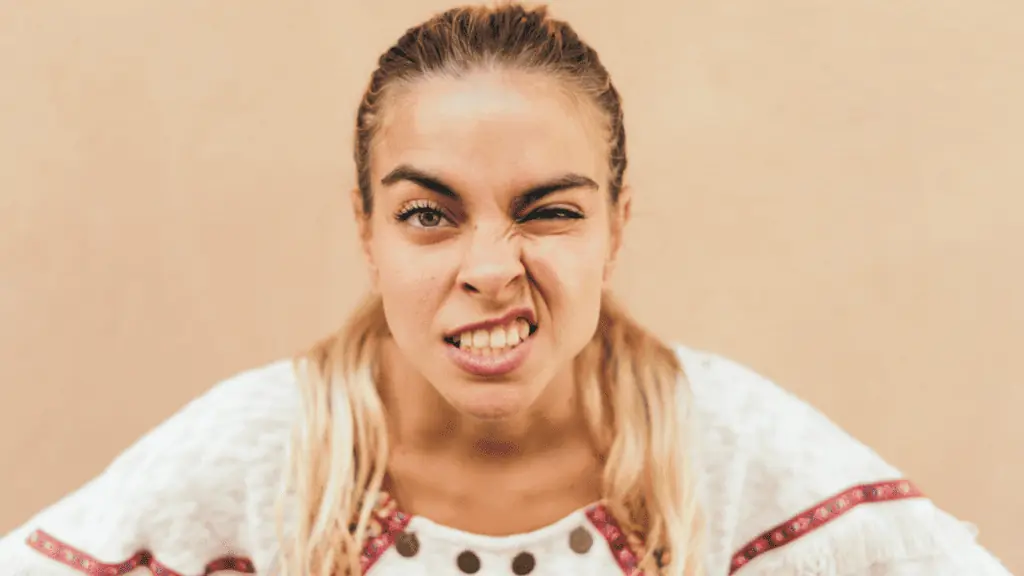 confused disgusted eyebrows woman sneer