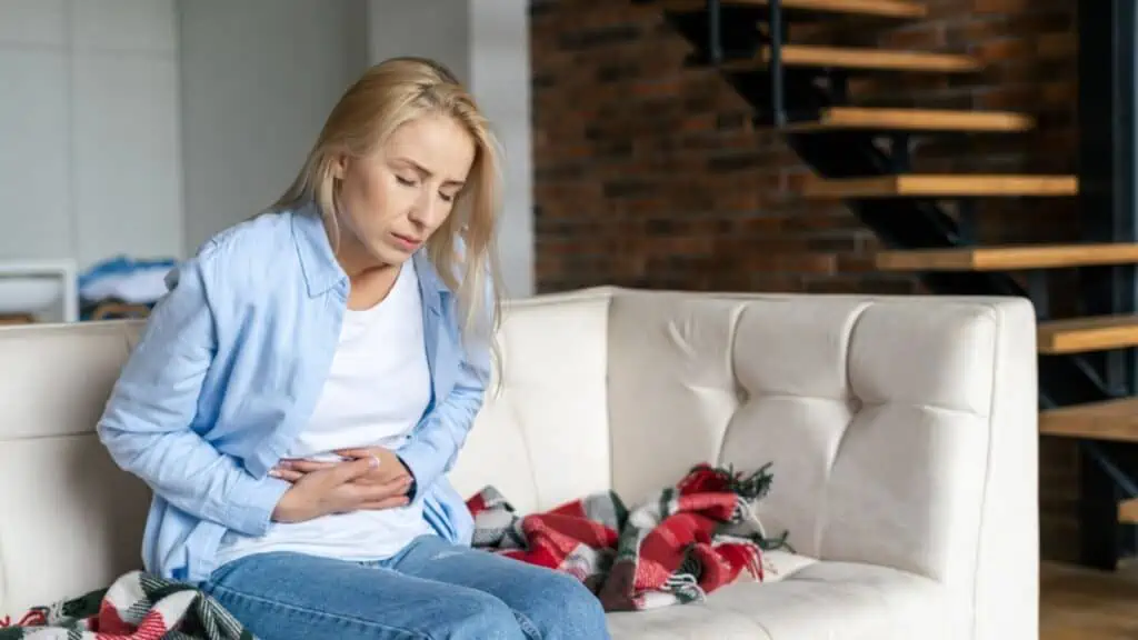 Woman feel menstruation pain and discomfort in the stomach