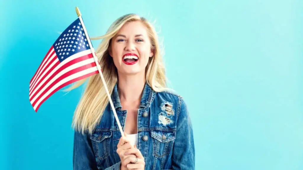 Woman holding American flag