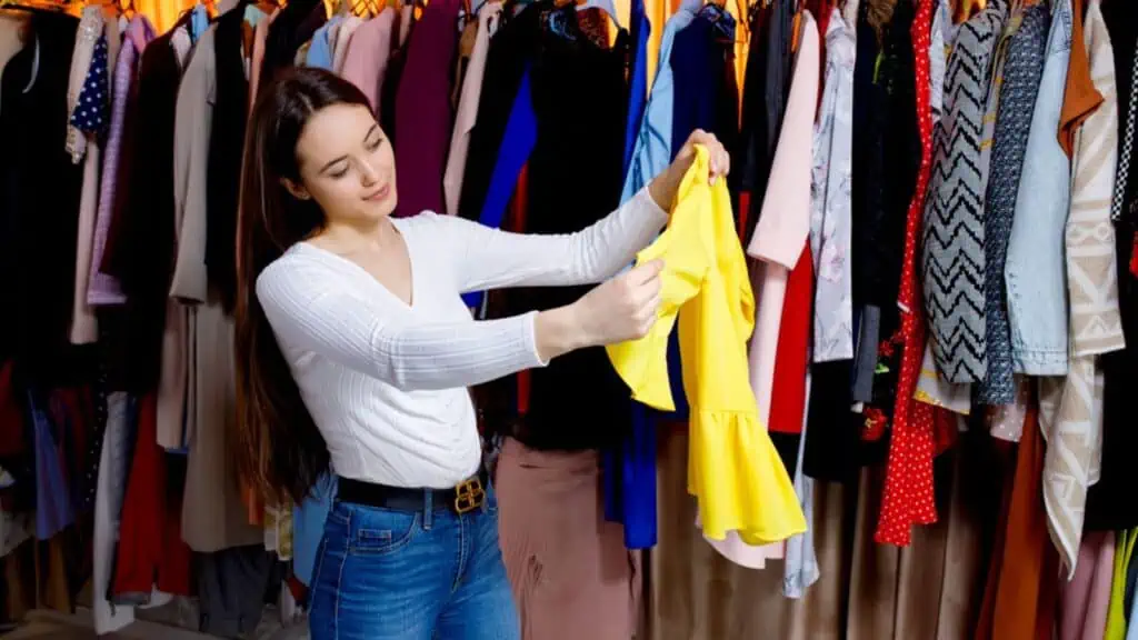 Woman holding her yellow shirt