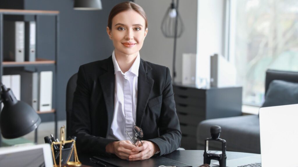 Woman lawyer sitting at workplace in office
