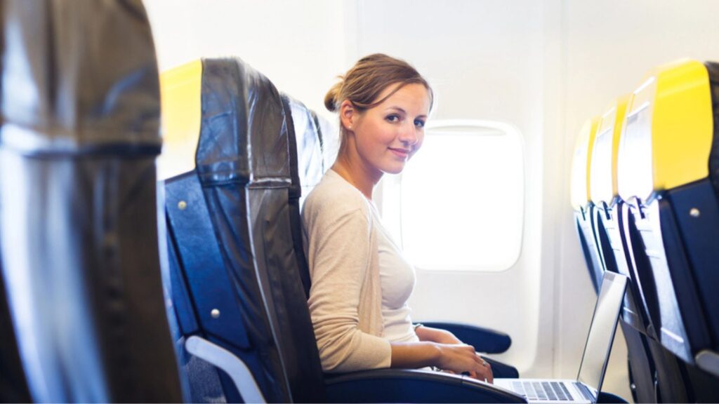 Woman looking and seated in airplane