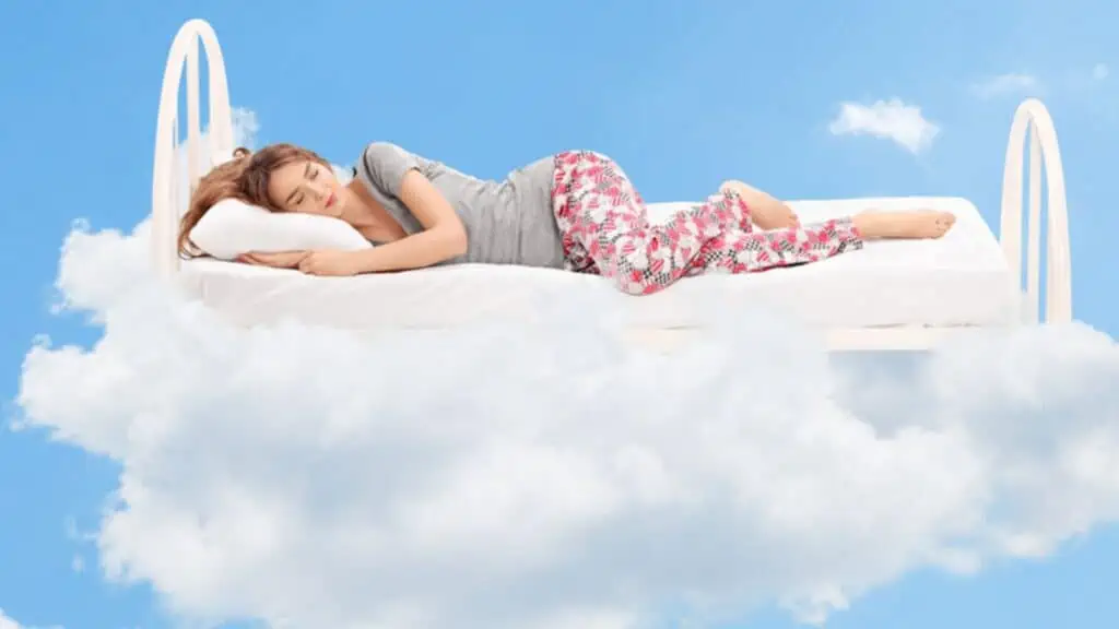 Woman sleeping in the clouds