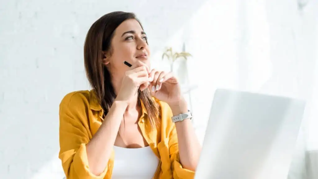 Woman thinking in her table