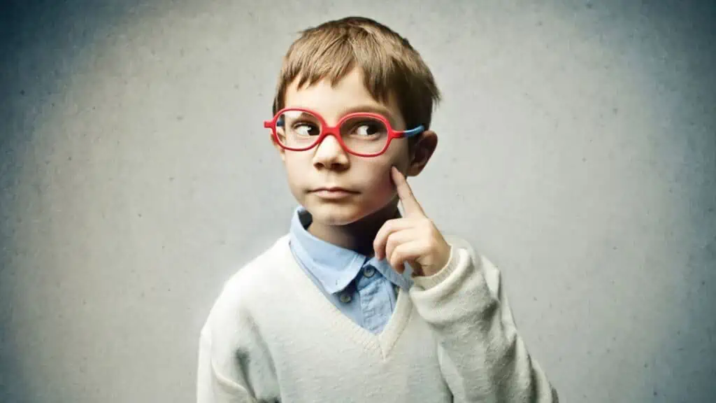 little boy thinking red glasses