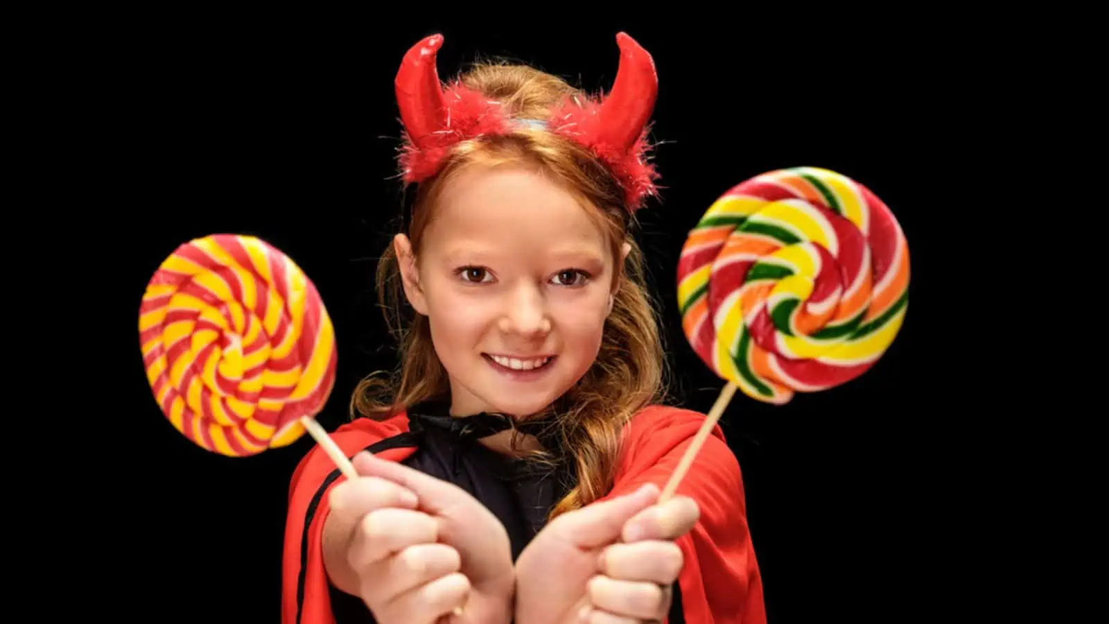 girl with candy halloween costume devil