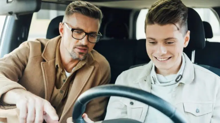 dad and son driving a car