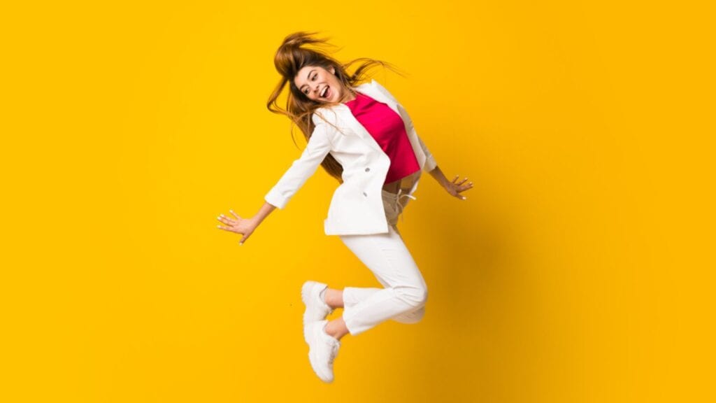 successful confident happy woman jumping