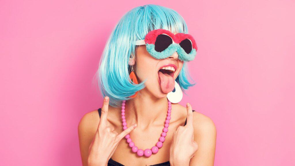 strange woman with blue hair tongue out eccentric
