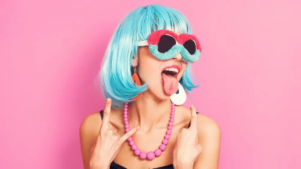 strange woman with blue hair tongue out eccentric