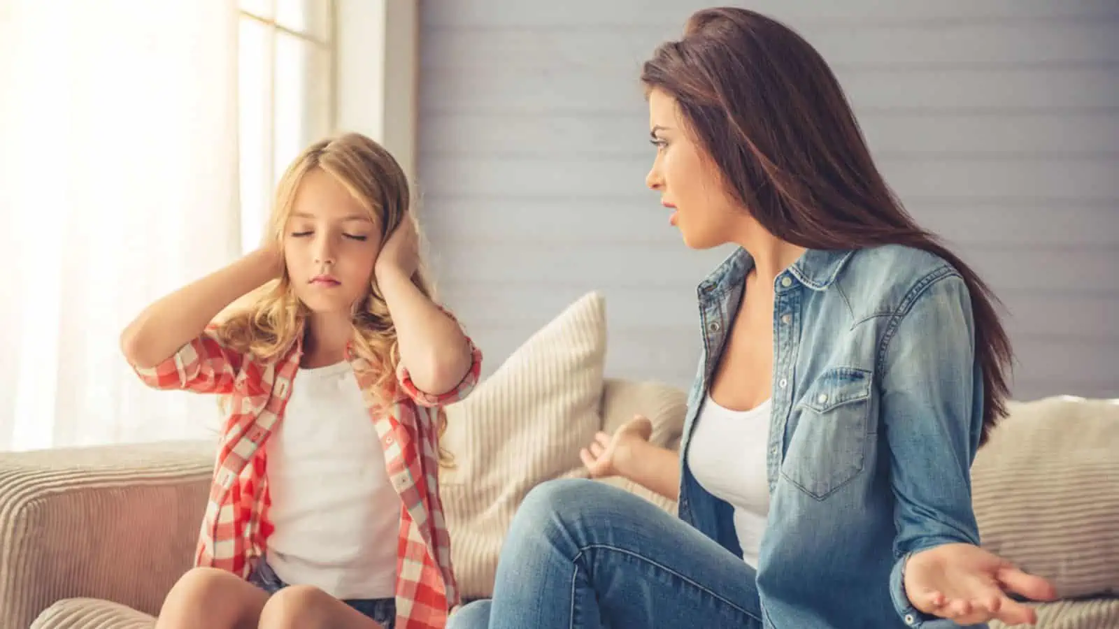 strict mad mom yelling at her daughter not listening