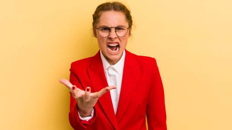angry woman frustrated yelling glasses red suit