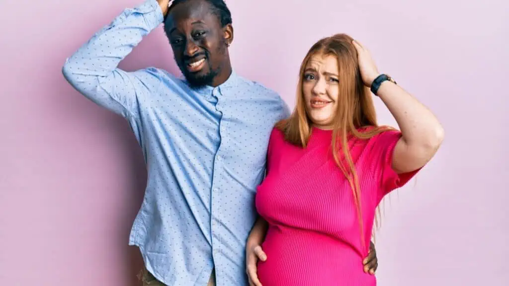 confused couple pregnant woman