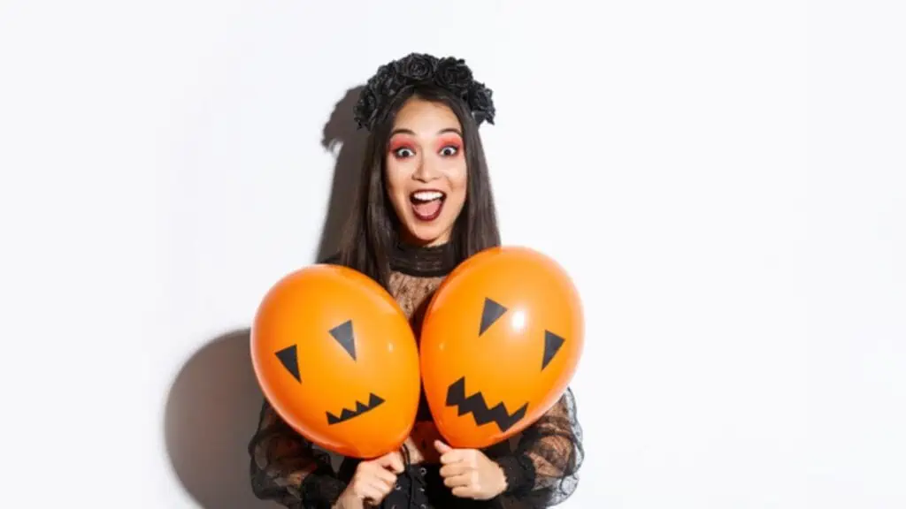 halloween balloons surprised happy woman