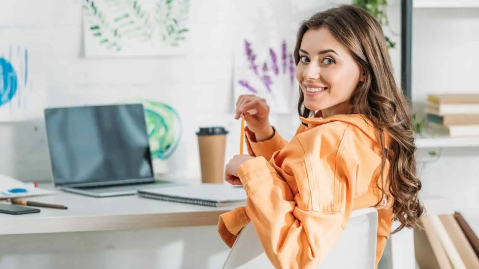 woman working from home at a computer coffee happy