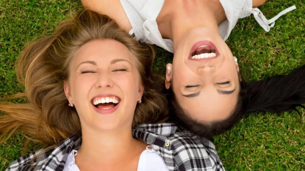 laughing woman happy smiling grass