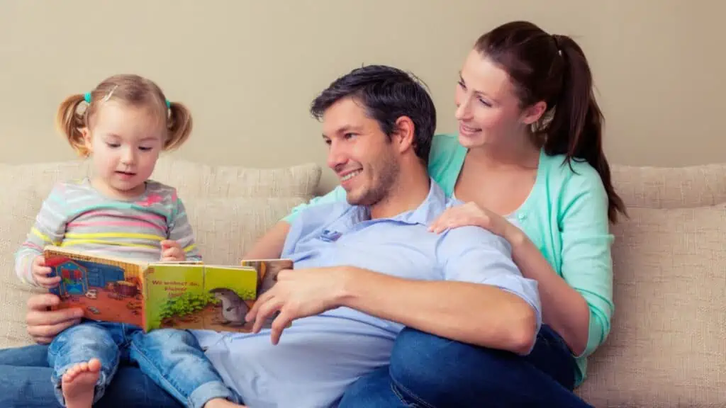 happy parents reading a book