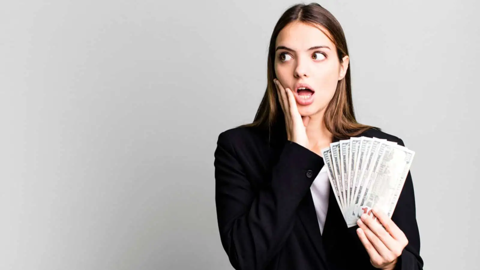 shocked woman with money