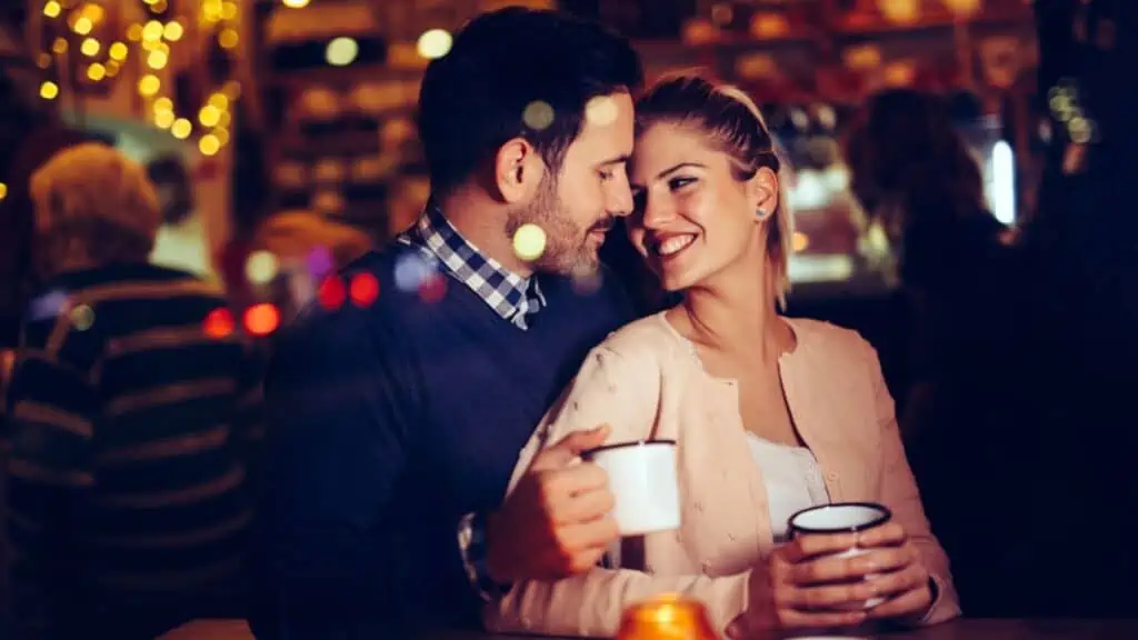 happy couple in love drinking at a bar date night