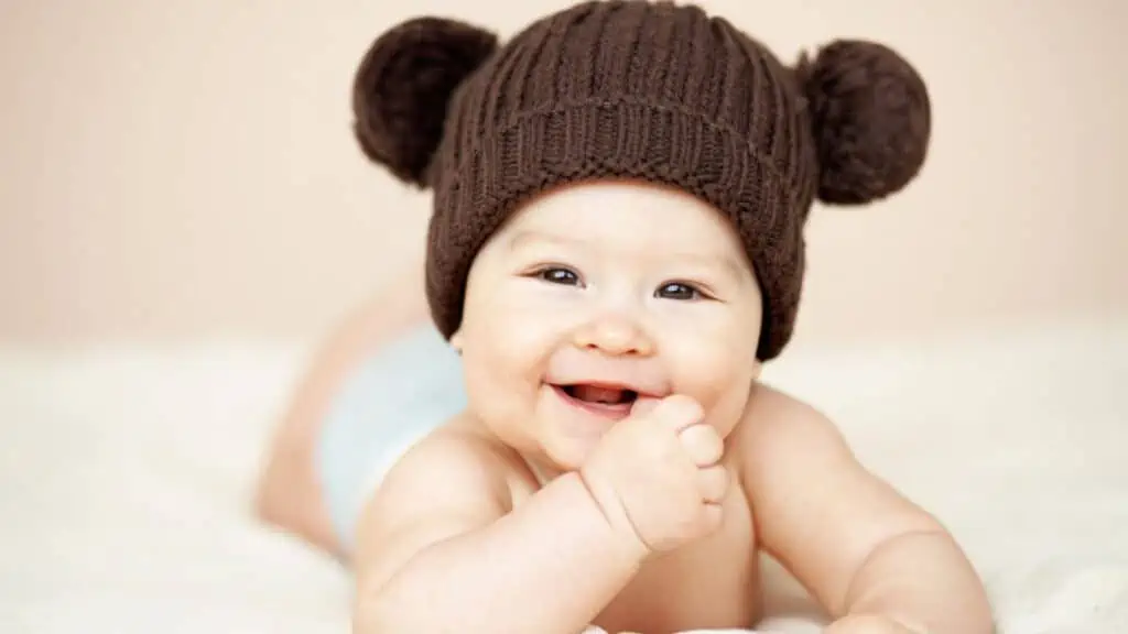 cute baby in a hat happy