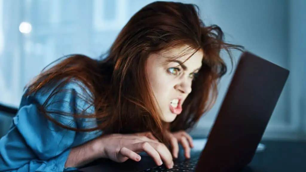 mad woman at the computer furious