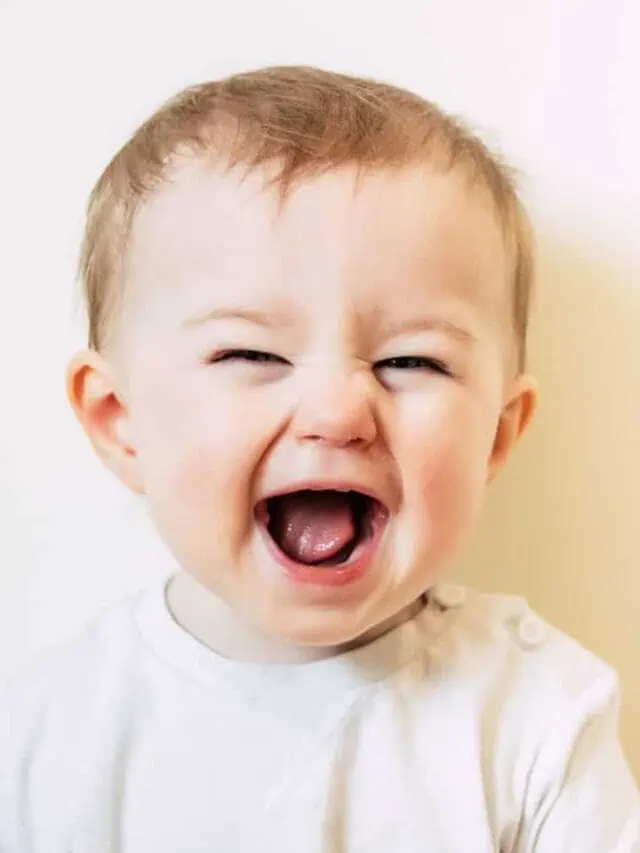 cute baby laughing with mouth open