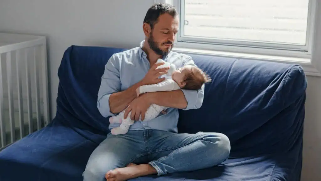 Dad feeding baby