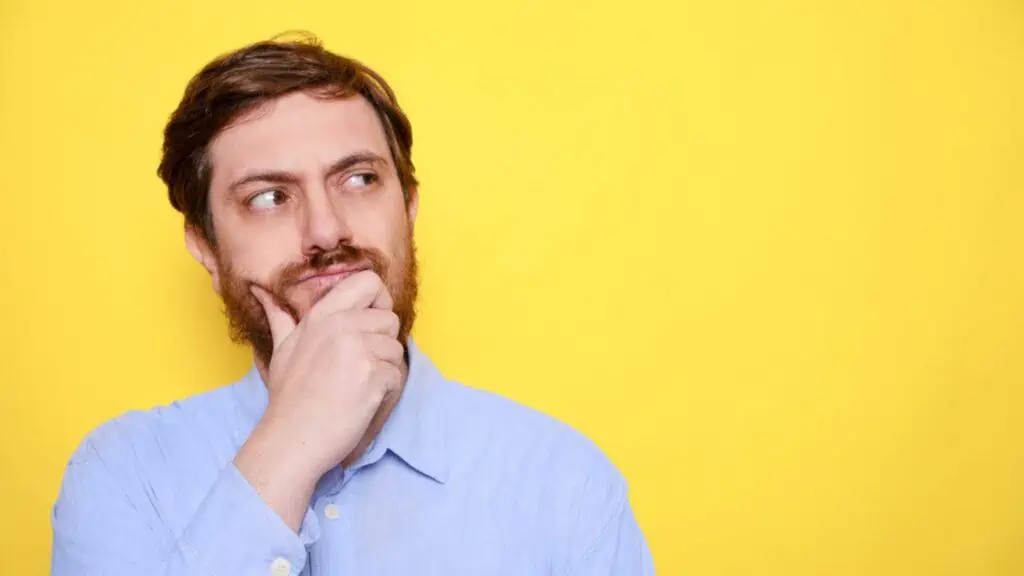 thinking man isolated on yellow background