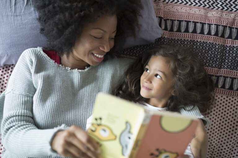 mom and daughter reading a book