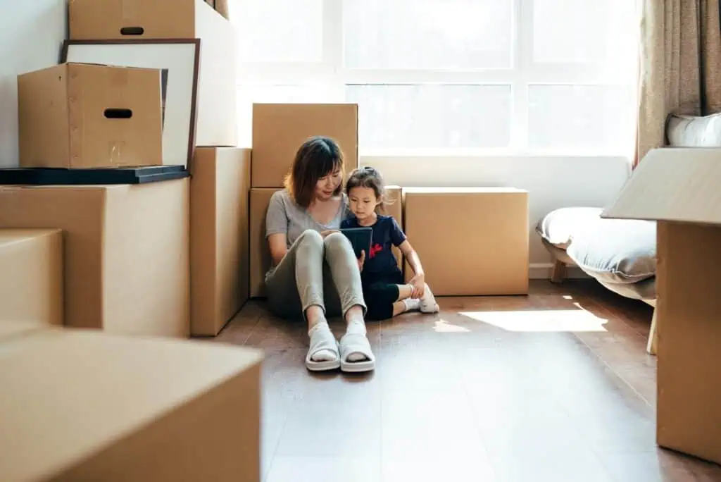 mom and daughter moving with boxes