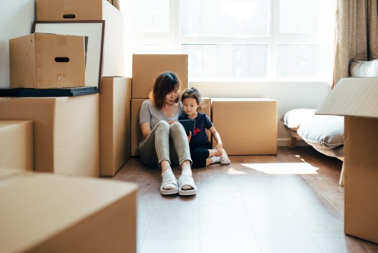 mom and daughter moving with boxes
